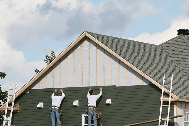 Professional Siding Installation technician working in Henderson, TN